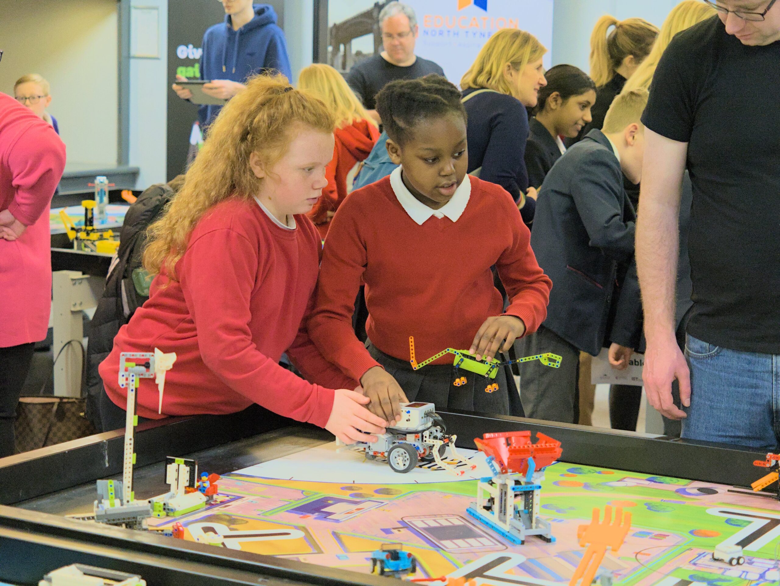 Girls in STEM - Two girls competing in FIRST LEGO League Challenge